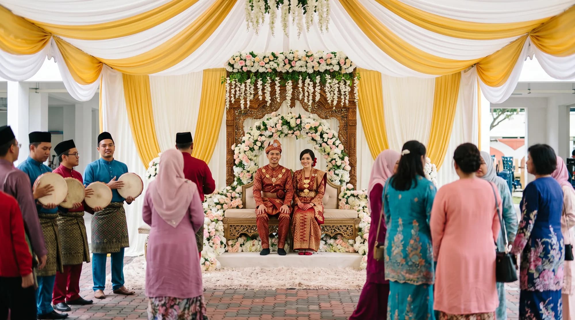 A Malay wedding in Singapore: the couple in matching songket outfits seated on an ornate pelamin dais at an HDB void deck decorated with drapes and flowers