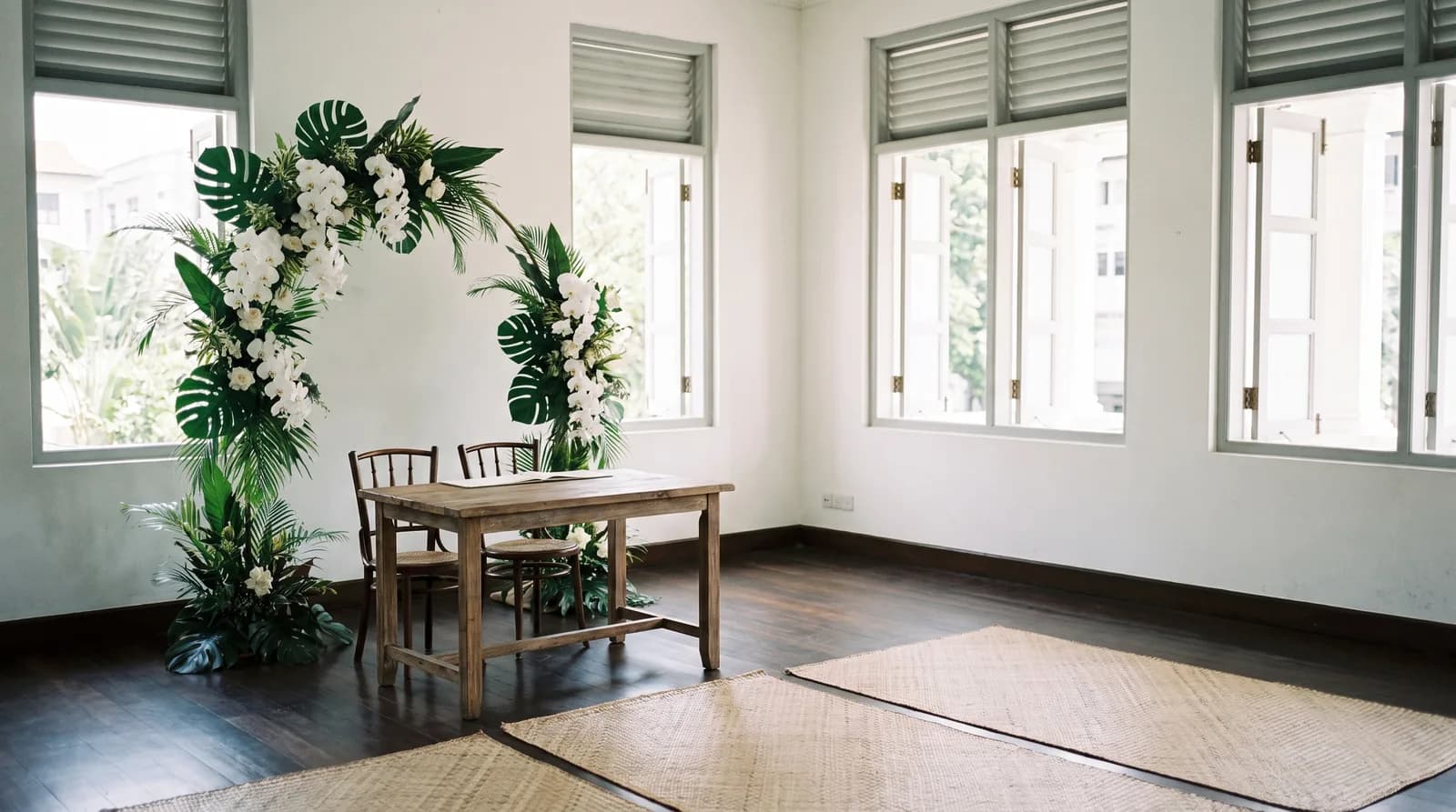 A small heritage black and white bungalow hall in Singapore set up for a solemnisation with a signing table